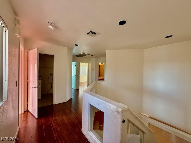 hallway featuring dark hardwood / wood-style flooring