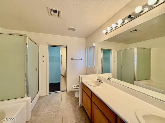 full bathroom with tile patterned flooring, vanity, toilet, and independent shower and bath