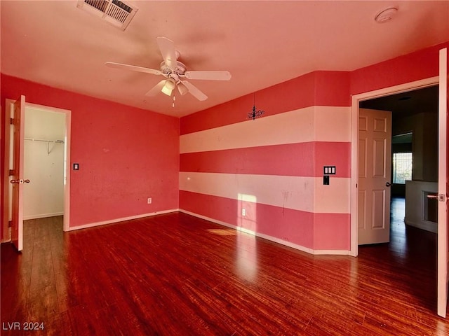 spare room featuring ceiling fan and hardwood / wood-style flooring