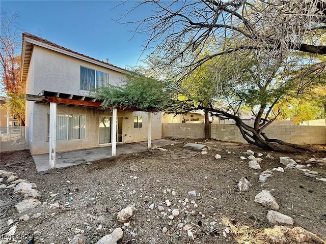 view of side of property featuring a patio