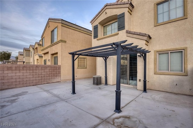 view of patio / terrace featuring central AC unit and a pergola