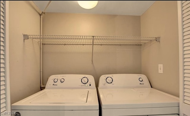 clothes washing area featuring independent washer and dryer