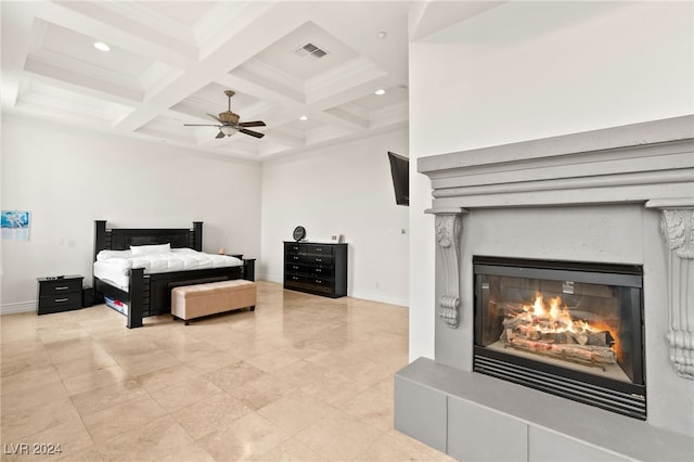 bedroom with beam ceiling, ceiling fan, and coffered ceiling