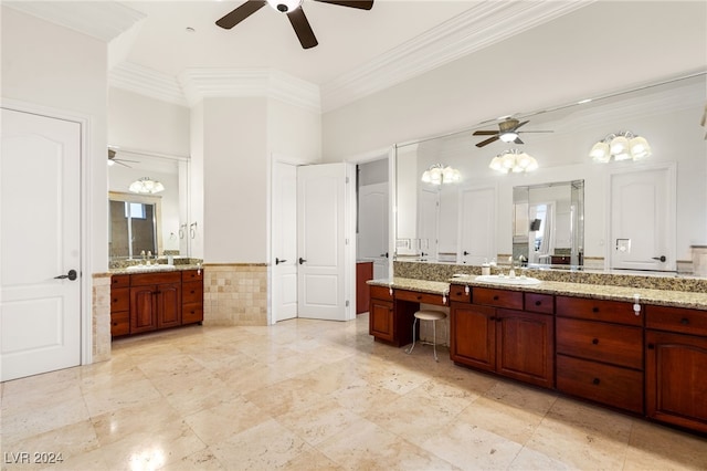 bathroom featuring a high ceiling, vanity, and ornamental molding