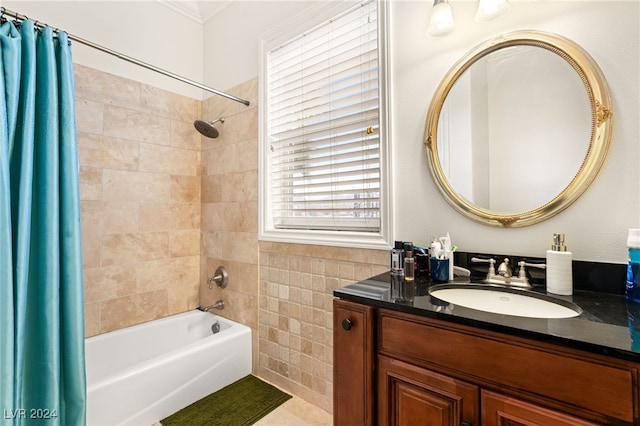 bathroom featuring tile patterned floors, vanity, shower / bathtub combination with curtain, and tile walls