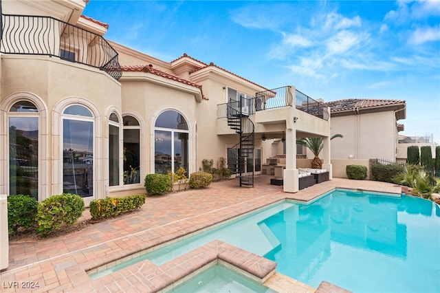 view of swimming pool with an in ground hot tub and a patio