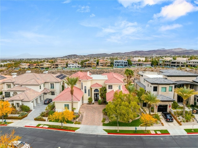 birds eye view of property featuring a mountain view