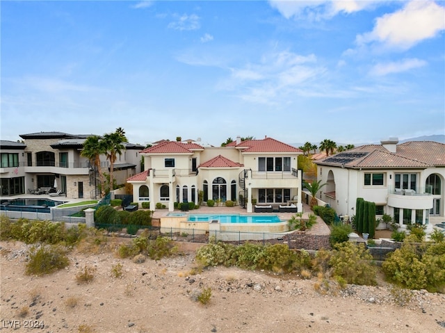 back of property featuring a balcony