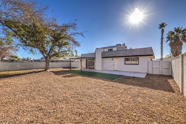 rear view of house featuring a patio