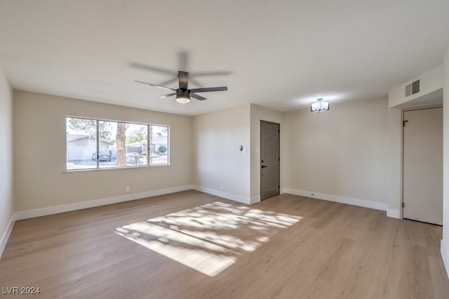 spare room with light hardwood / wood-style flooring and ceiling fan