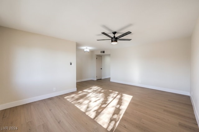 spare room featuring ceiling fan and light wood-type flooring