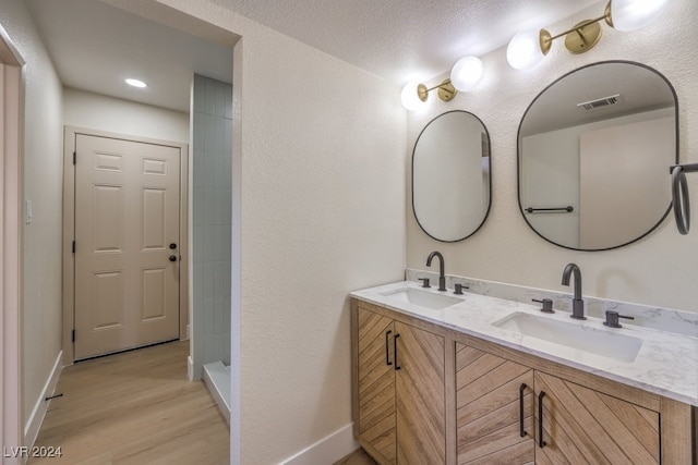 bathroom featuring vanity and wood-type flooring