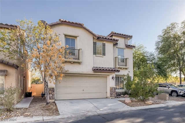 mediterranean / spanish-style house featuring a garage