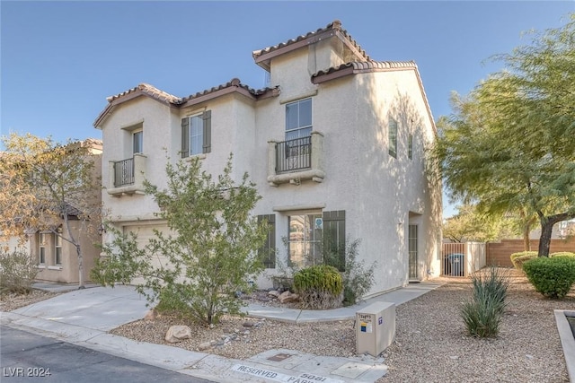 mediterranean / spanish house with a garage