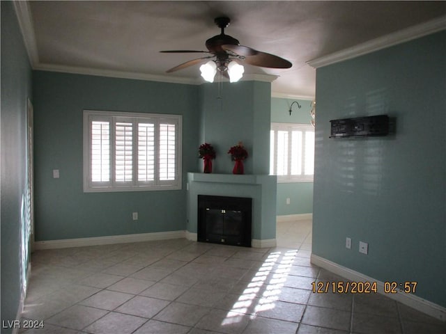 unfurnished living room featuring ceiling fan, light tile patterned floors, and crown molding