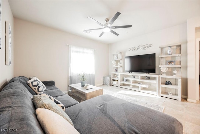 living room featuring ceiling fan and light tile patterned floors