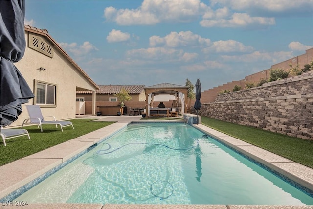 view of pool with a gazebo, a patio, and a lawn