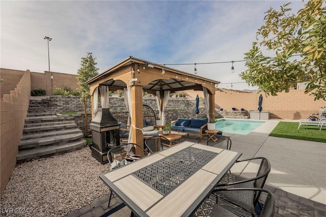 view of patio / terrace featuring a gazebo, outdoor lounge area, and a fenced in pool