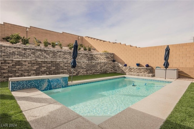 view of swimming pool featuring pool water feature