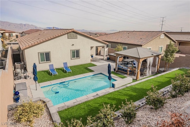 view of swimming pool featuring a gazebo, a yard, a patio, and central AC