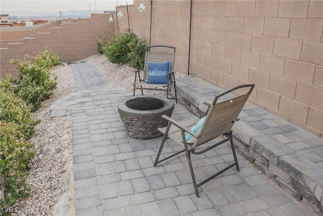 view of patio with an outdoor fire pit