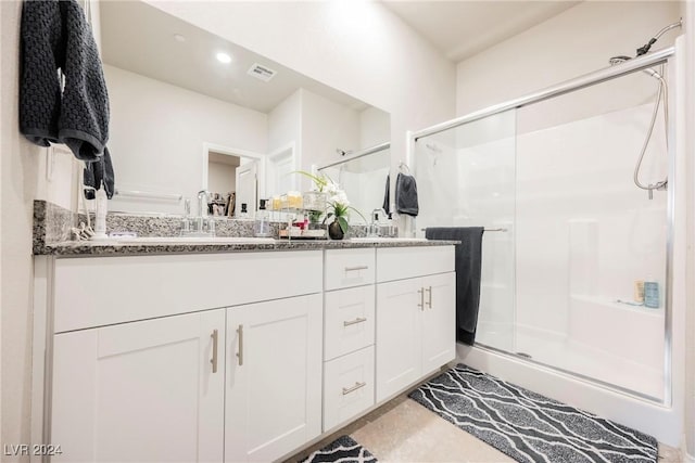 bathroom with vanity and walk in shower