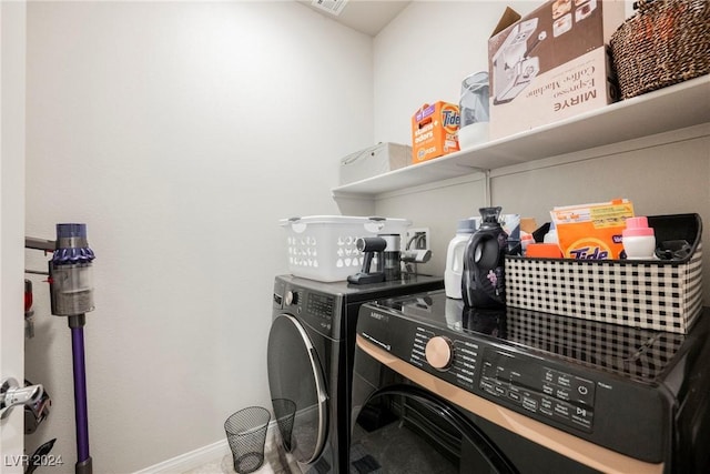 laundry area with independent washer and dryer