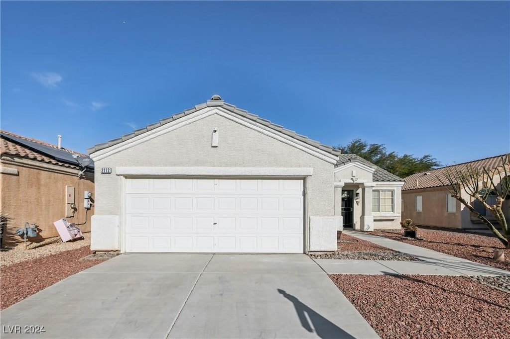 single story home featuring a garage