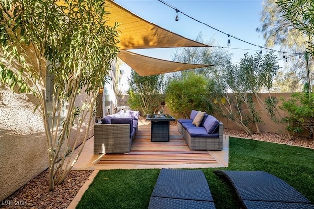 wooden deck featuring an outdoor hangout area and a lawn