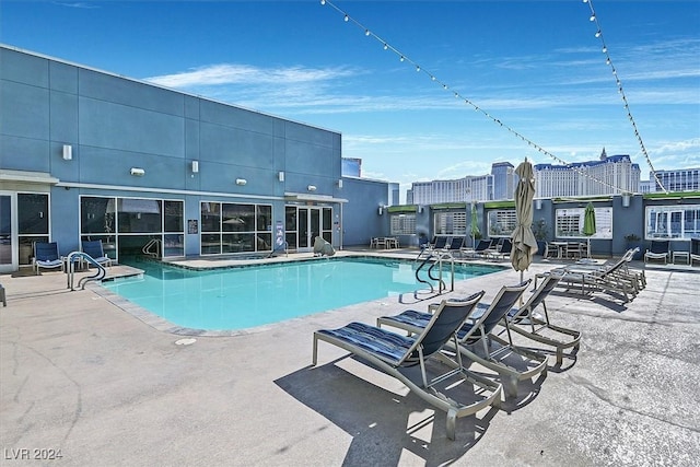 view of swimming pool featuring a patio area