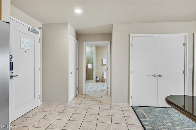 interior space with light tile patterned floors