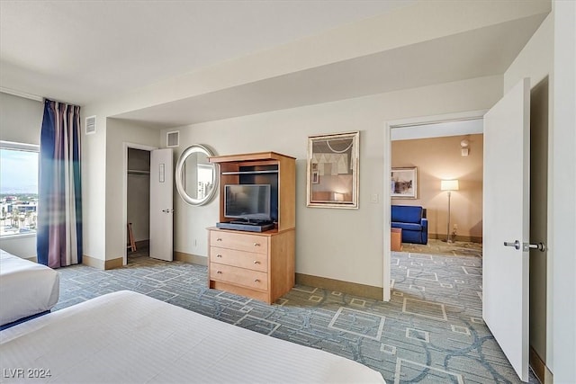 bedroom with dark colored carpet