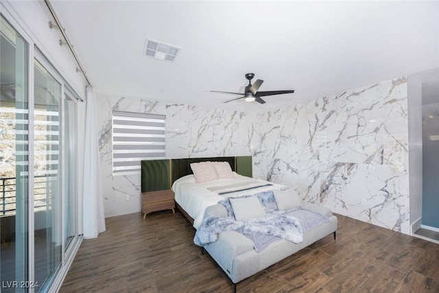 bedroom featuring ceiling fan and dark wood-type flooring