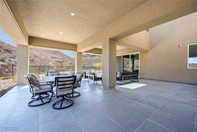 view of patio featuring outdoor lounge area and a mountain view