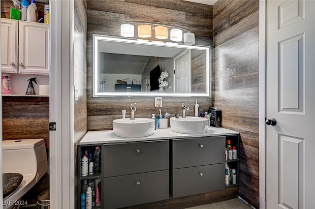 bathroom featuring vanity and toilet