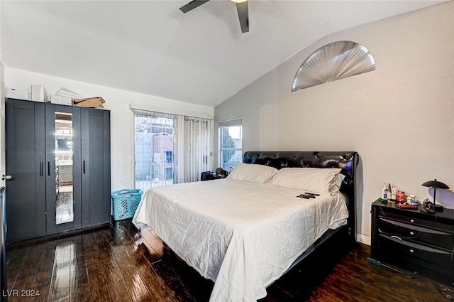 bedroom featuring lofted ceiling, ceiling fan, and dark wood-type flooring