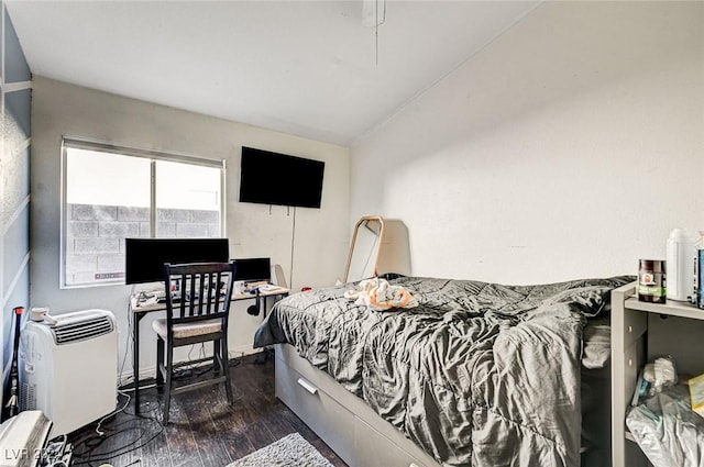 bedroom with dark hardwood / wood-style floors and vaulted ceiling