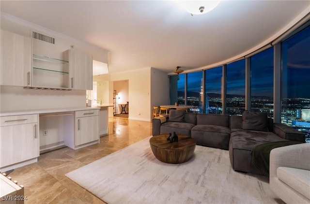 living room with baseboards and visible vents