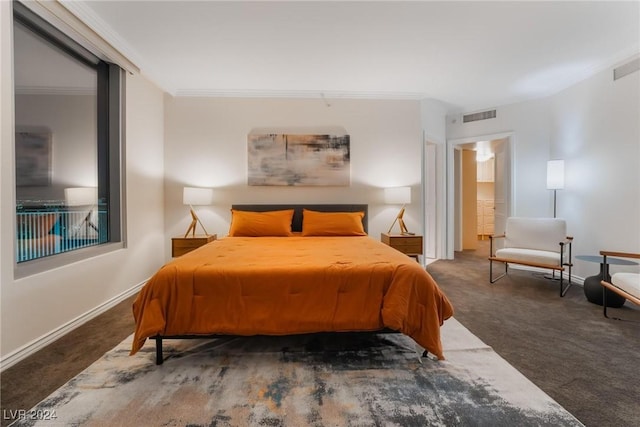 bedroom featuring dark colored carpet and ornamental molding