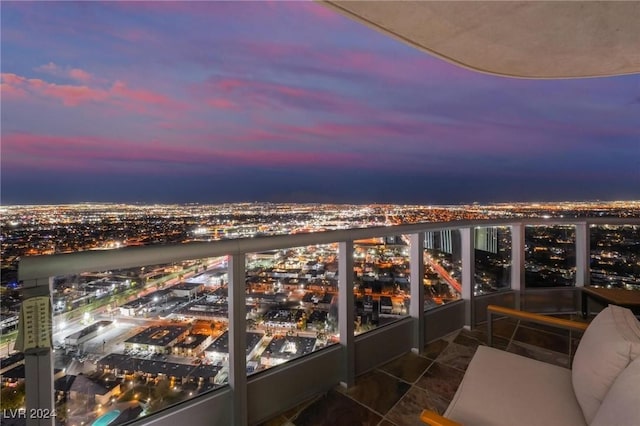 balcony at dusk with a city view