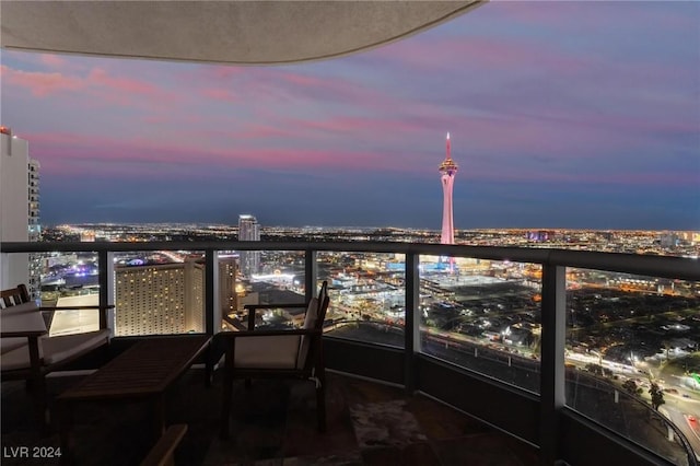 view of balcony at dusk