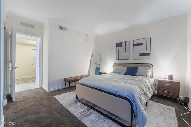 bedroom with baseboards, visible vents, carpet flooring, and crown molding
