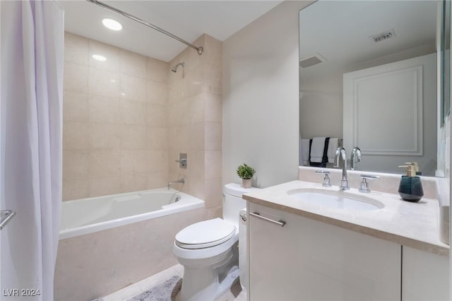 bathroom featuring vanity, visible vents, shower / bathtub combination with curtain, and toilet