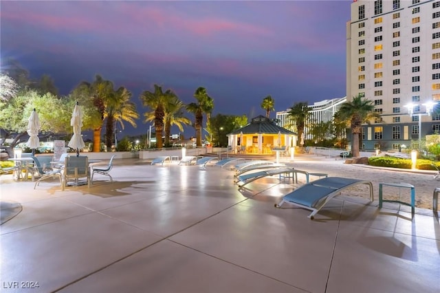 view of pool at dusk