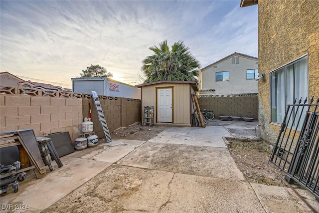 patio terrace at dusk with a storage unit