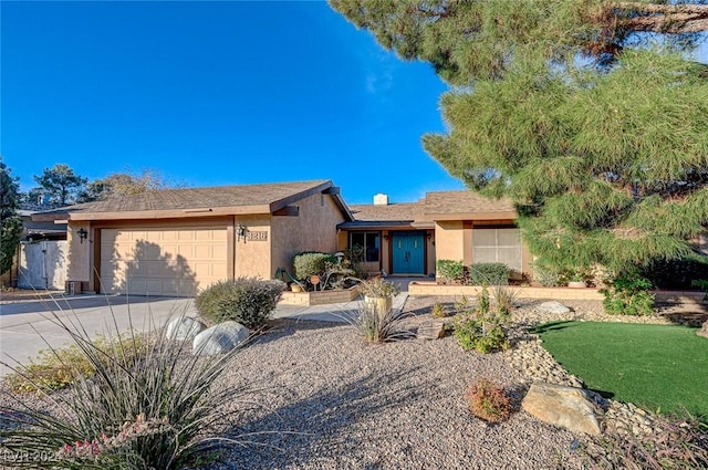 single story home with a garage