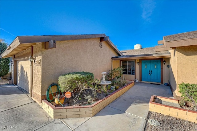 entrance to property featuring a garage