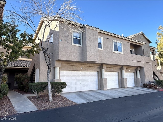 multi unit property featuring a garage