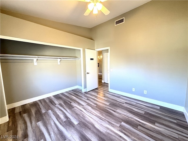 unfurnished bedroom featuring hardwood / wood-style floors, ceiling fan, and a closet