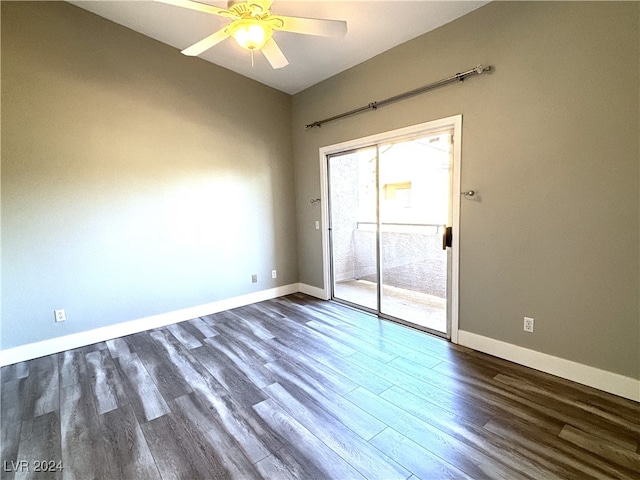 empty room with dark hardwood / wood-style floors and ceiling fan